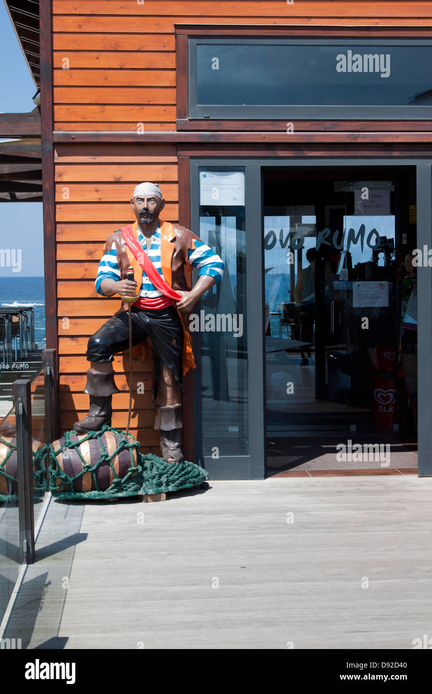full body pirate`s sculpture standing at pizzeria entrance Stock Photo